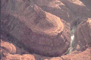 Rivers are sculptors, putting wavy lines into what is seen from afar. Utah, 1962.
